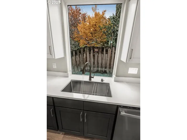 a sink and a window in a bathroom