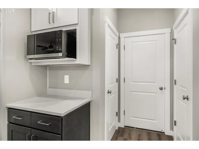 a kitchen with a sink and a microwave