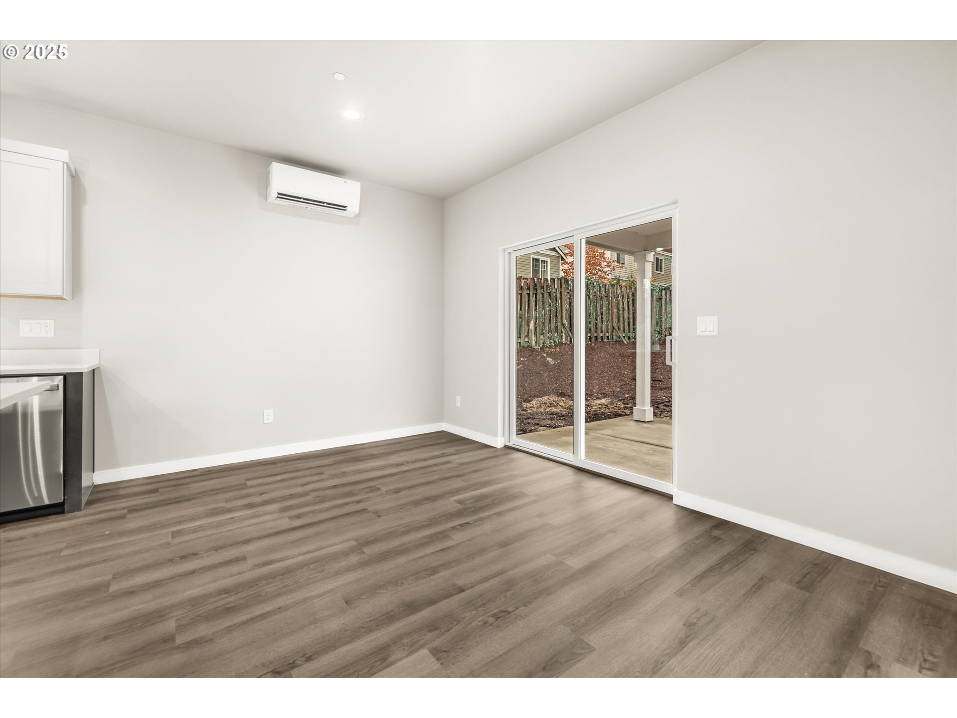 185 Southwest Mawrcrest Avenue Gresham, OR 97030 - Photo 26 of 46 a view of an empty room with wooden floor and a window