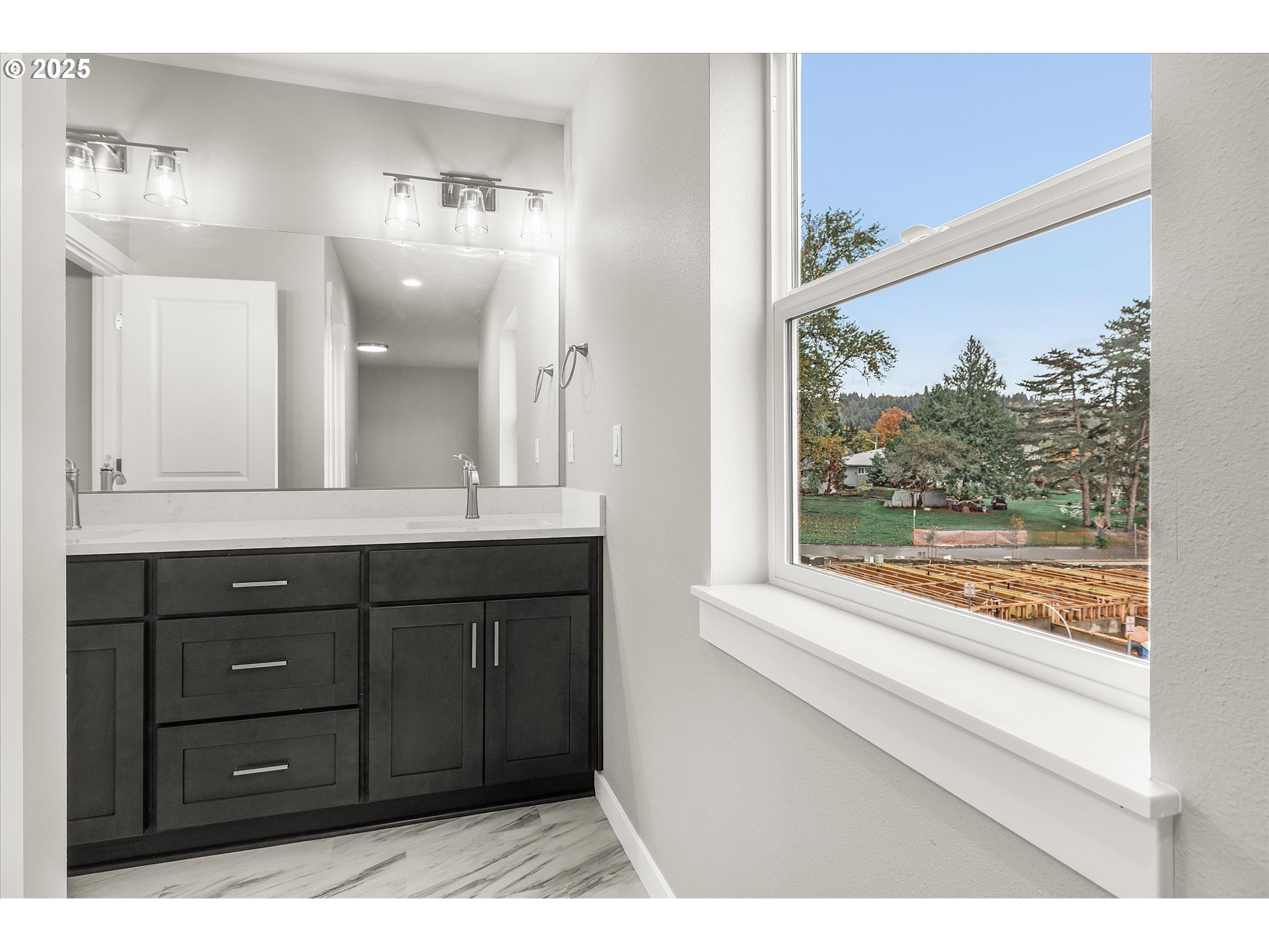 185 Southwest Mawrcrest Avenue Gresham, OR 97030 - Photo 28 of 46 a bathroom with a vanity a sink and a mirror