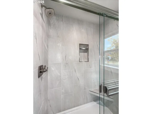 a bathroom with a shower and a toilet