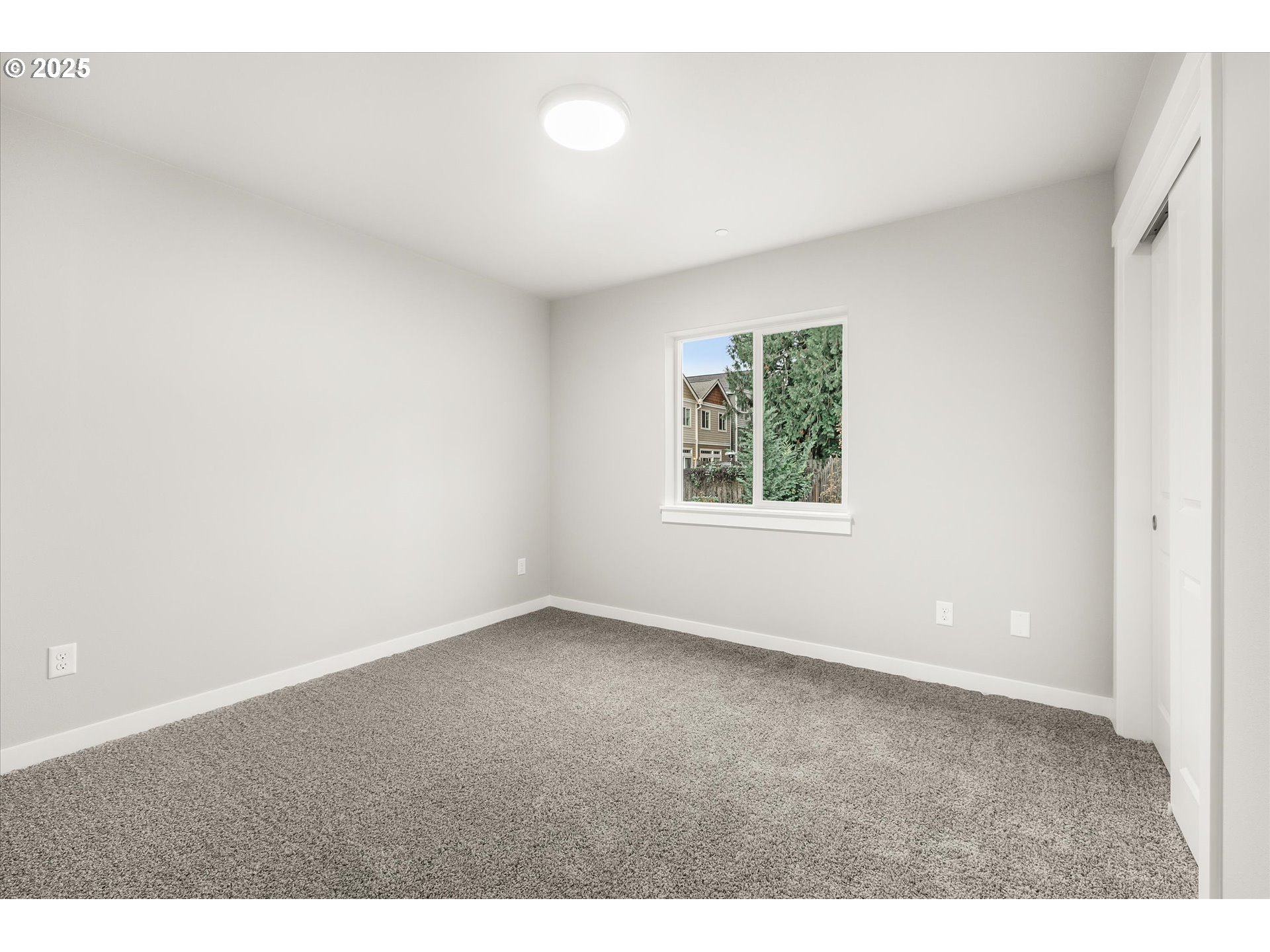185 Southwest Mawrcrest Avenue Gresham, OR 97030 - Photo 37 of 46 a view of an empty room with a window