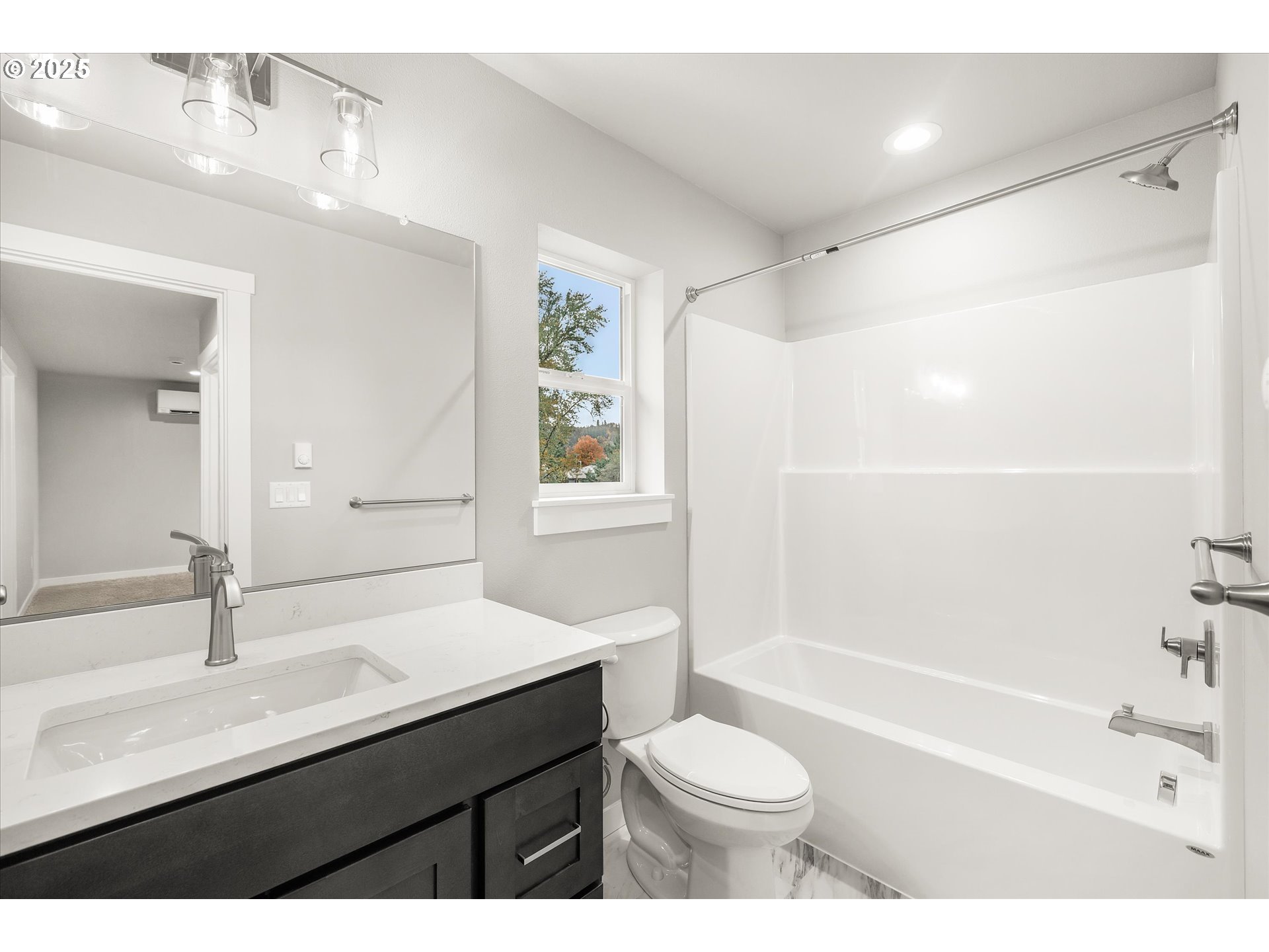 185 Southwest Mawrcrest Avenue Gresham, OR 97030 - Photo 38 of 46 a bathroom with a sink a toilet a mirror and shower