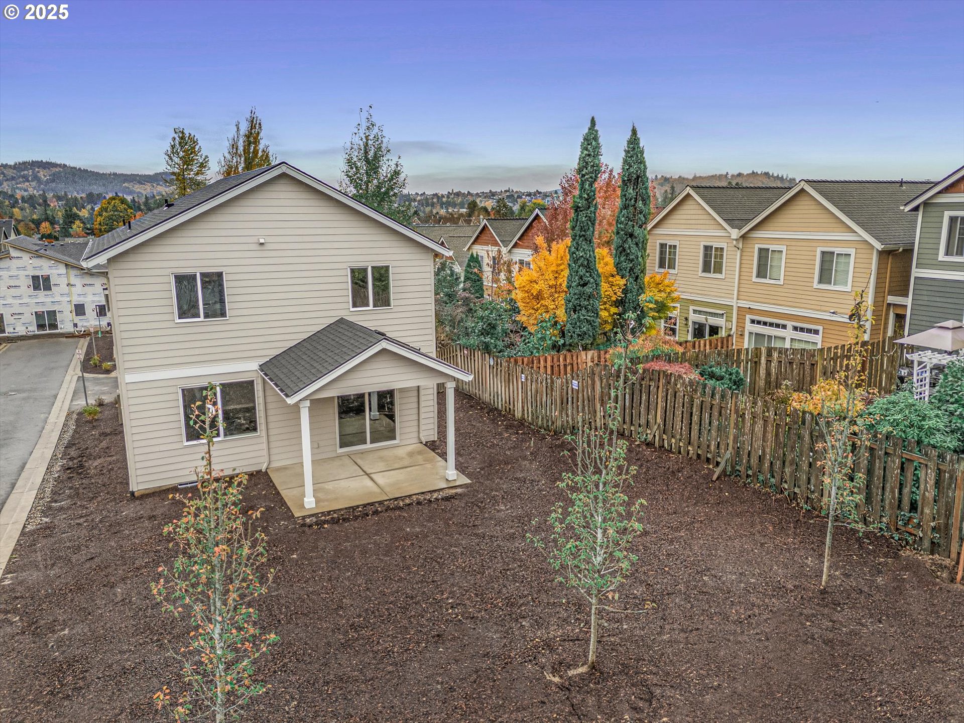 185 Southwest Mawrcrest Avenue Gresham, OR 97030 - Photo 5 of 46 a view of a house with a yard and potted plants