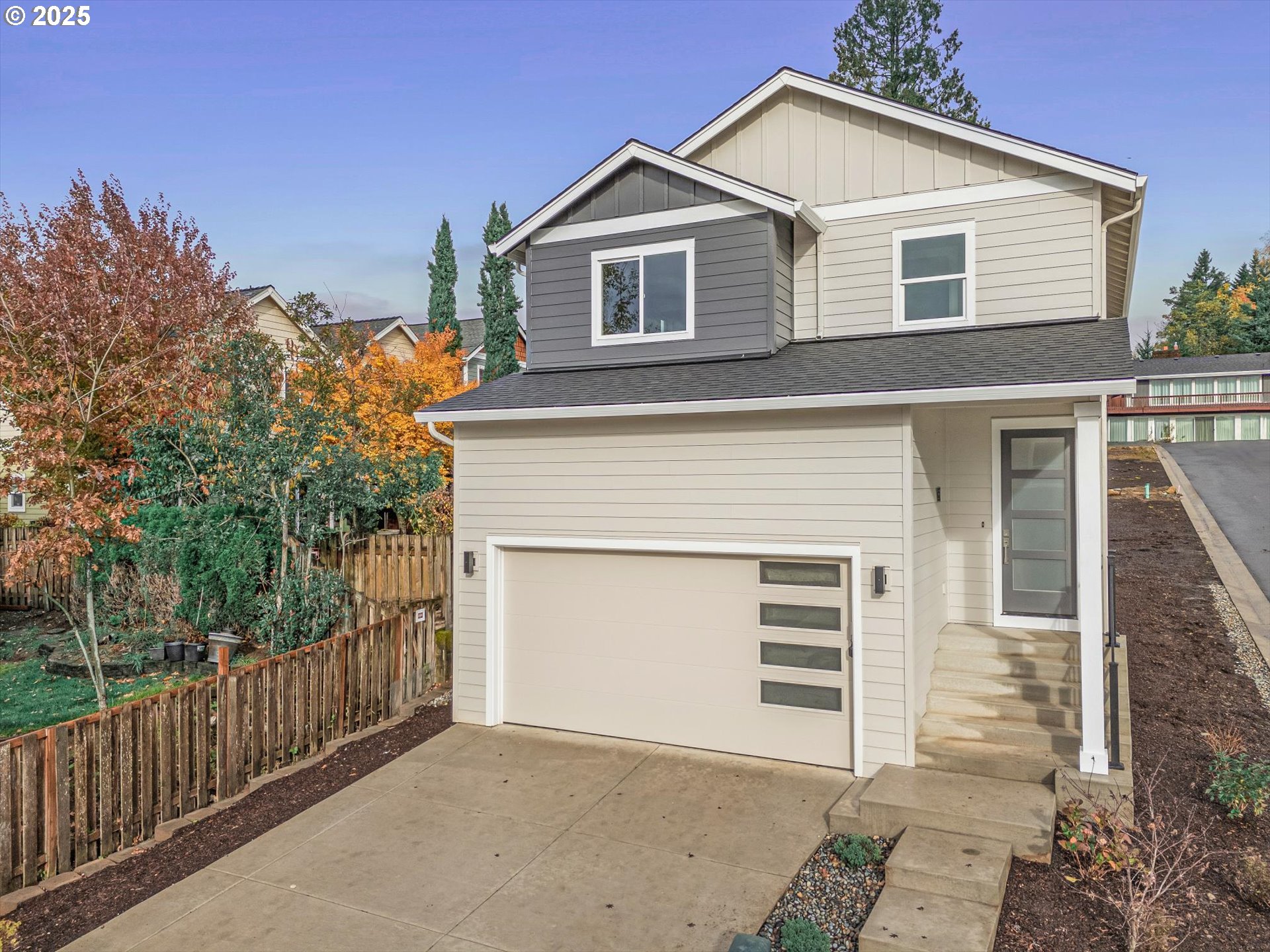 185 Southwest Mawrcrest Avenue Gresham, OR 97030 - Photo 8 of 46 a front view of a house with a garage