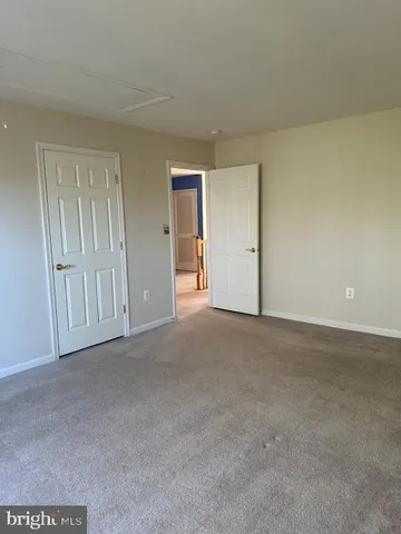 a view of an empty room and entryway