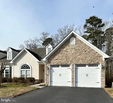 a view of a white house with a outdoor space