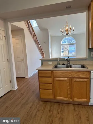 a view of kitchen with granite countertop cabinets a sink and dishwasher