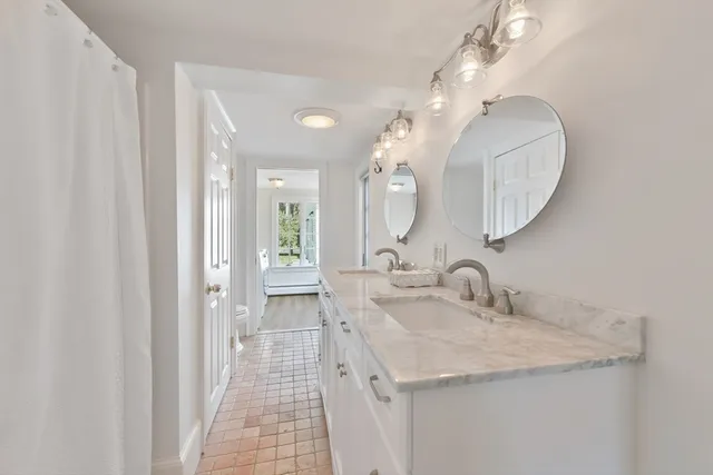 a bed room with a bed and a chair