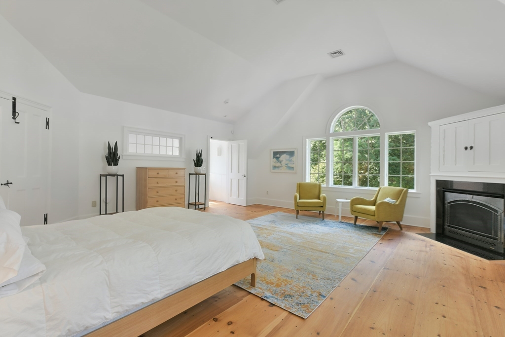 74 Wright Road Ashby, MA 01431 - Photo 13 of 26 a bed room with a bed and a chair