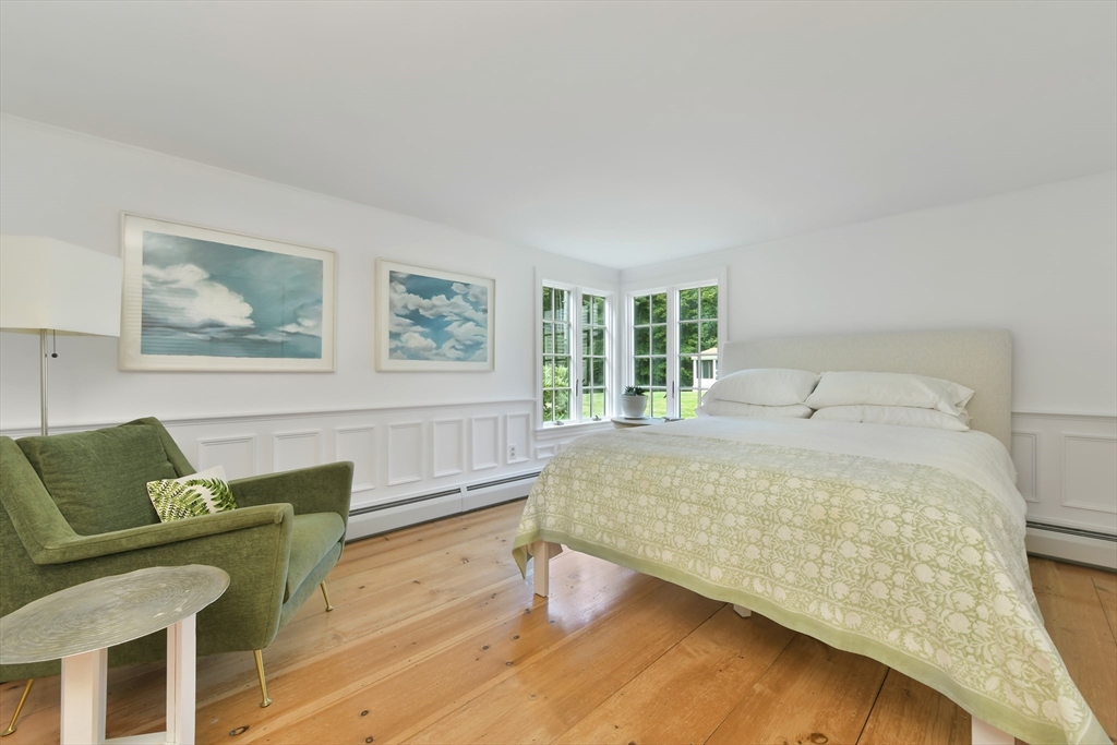 74 Wright Road Ashby, MA 01431 - Photo 16 of 26 a bedroom with a bed and wooden floor