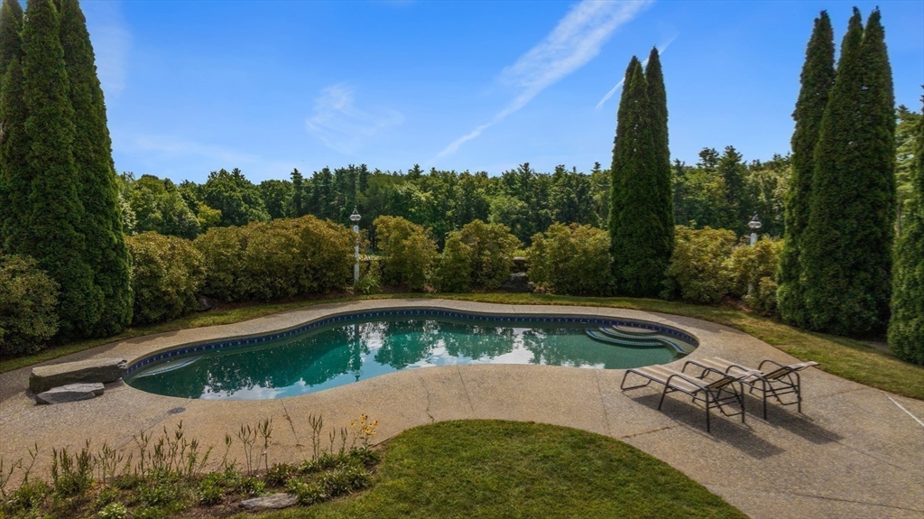 74 Wright Road Ashby, MA 01431 - Photo 2 of 26 a view of a swimming pool with a yard