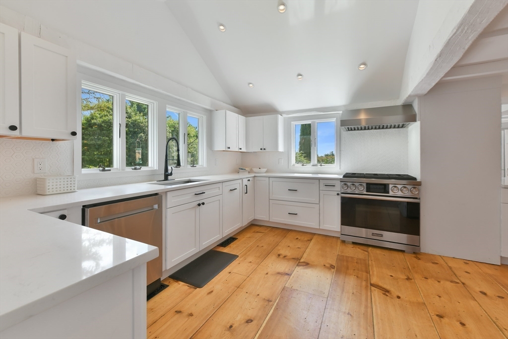 74 Wright Road Ashby, MA 01431 - Photo 7 of 26 a kitchen with stainless steel appliances granite countertop a stove a sink and a refrigerator