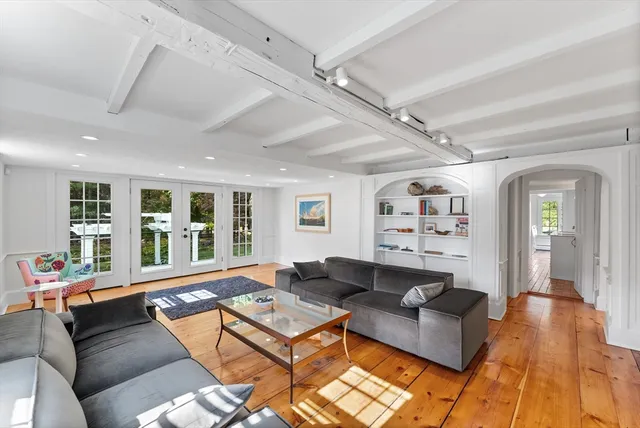 a very nice looking living room with a large window