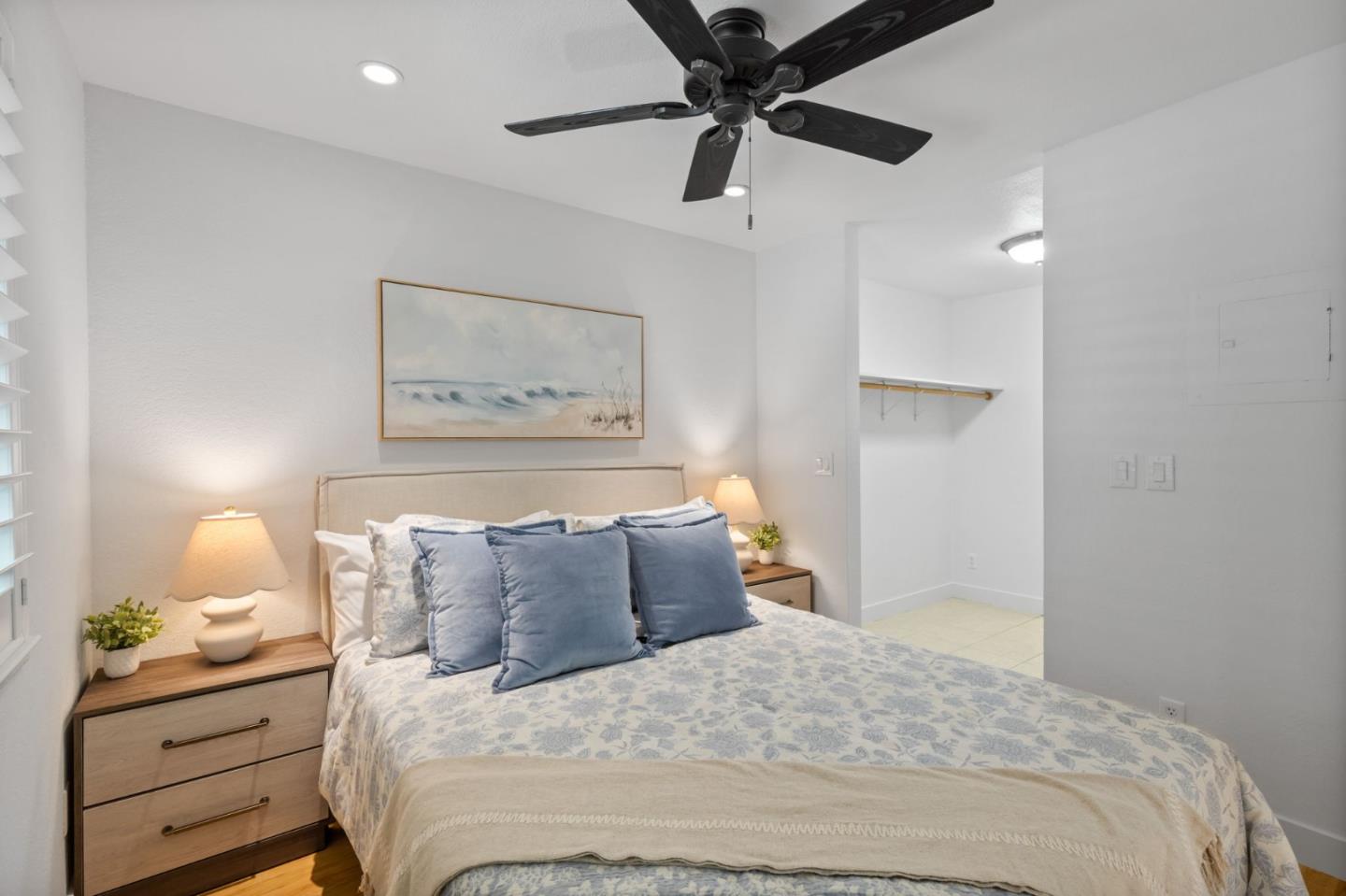 5701 Makati Circle, Unit C San Jose, CA 95123 - Photo 17 of 28 a bedroom with a bed and a painting on the wall