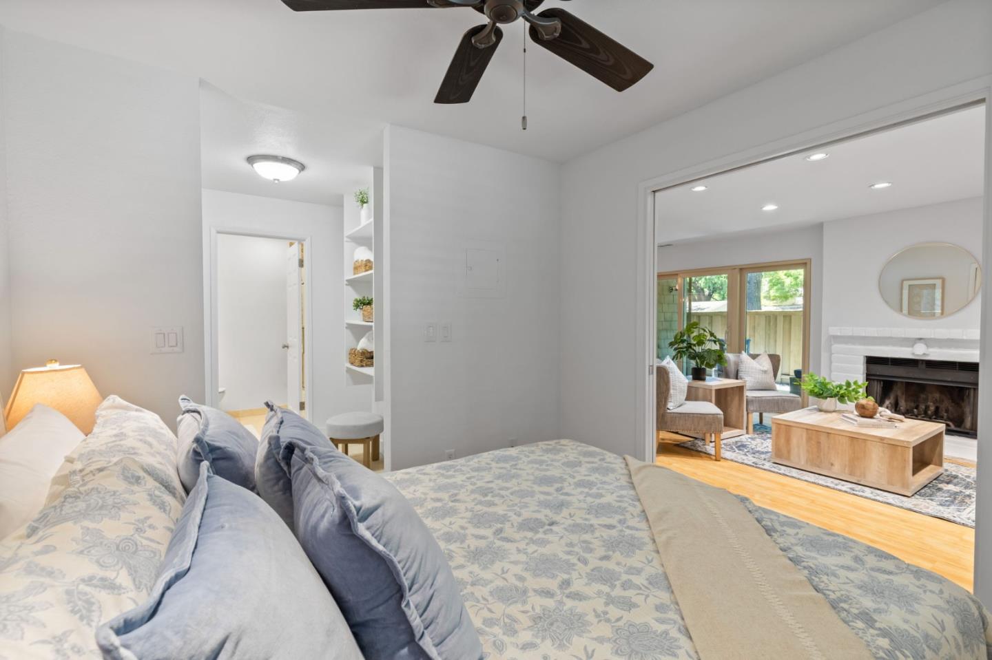 5701 Makati Circle, Unit C San Jose, CA 95123 - Photo 18 of 28 a bedroom with a bed couch and a fireplace