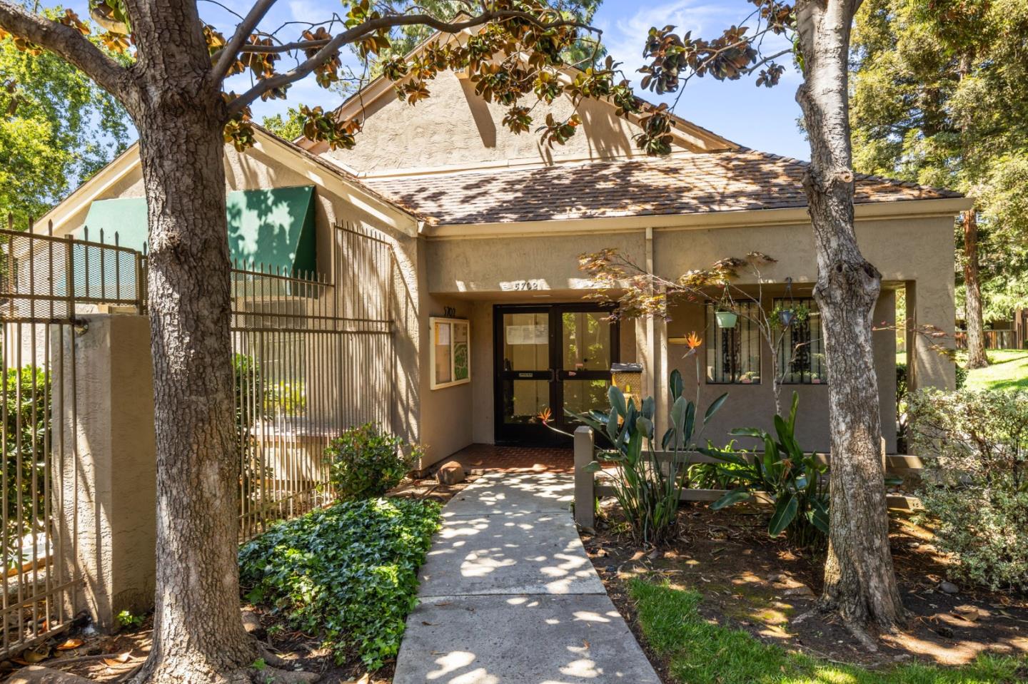 5701 Makati Circle, Unit C San Jose, CA 95123 - Photo 26 of 28 a front view of a house with a garden
