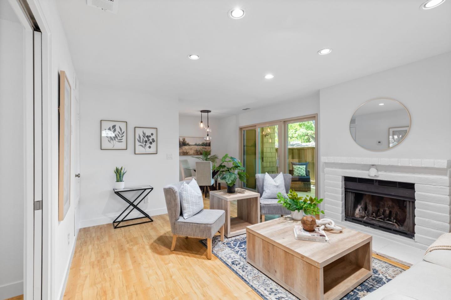 5701 Makati Circle, Unit C San Jose, CA 95123 - Photo 6 of 28 a living room with furniture and a fireplace