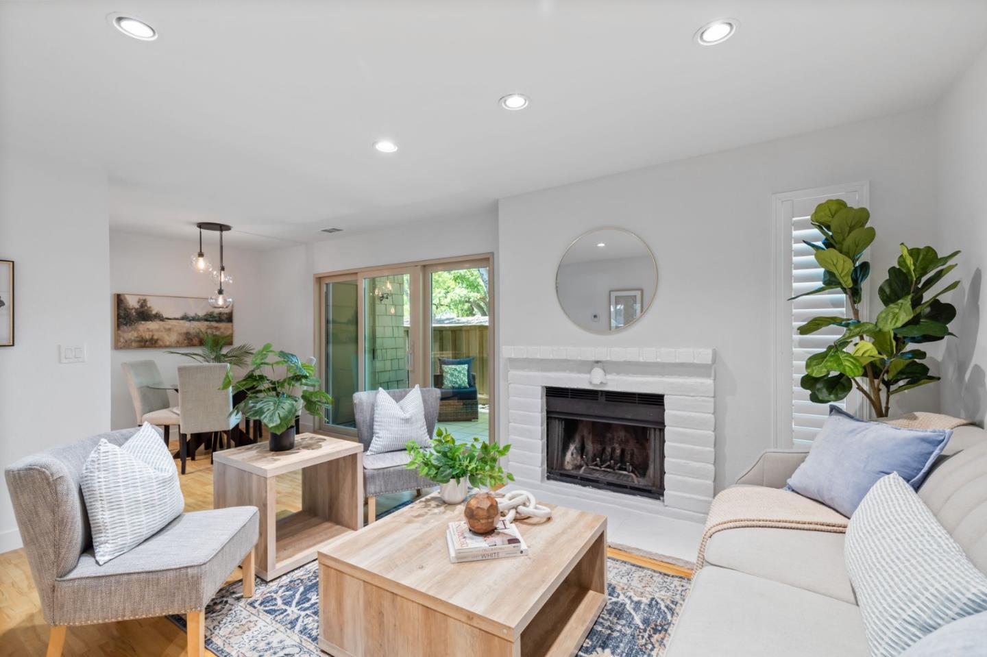 5701 Makati Circle, Unit C San Jose, CA 95123 - Photo 7 of 28 a living room with furniture a fireplace and a potted plant