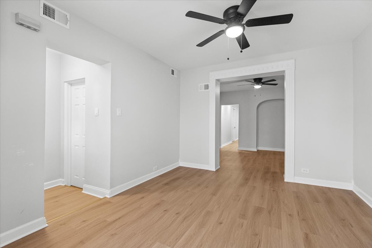 3709 North Troy Street, Unit 1 Chicago, IL 60618 - Photo 11 of 12 wooden floor in an empty room