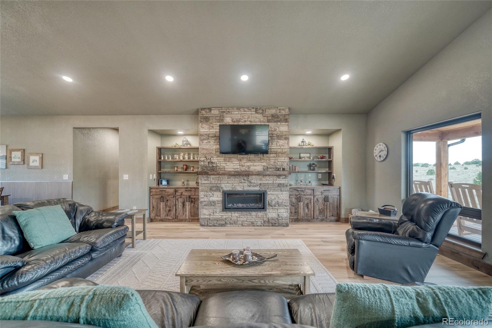 946 Hitching Post Road Cotopaxi, CO 81223 - Photo 12 of 50 a living room with furniture and a fireplace