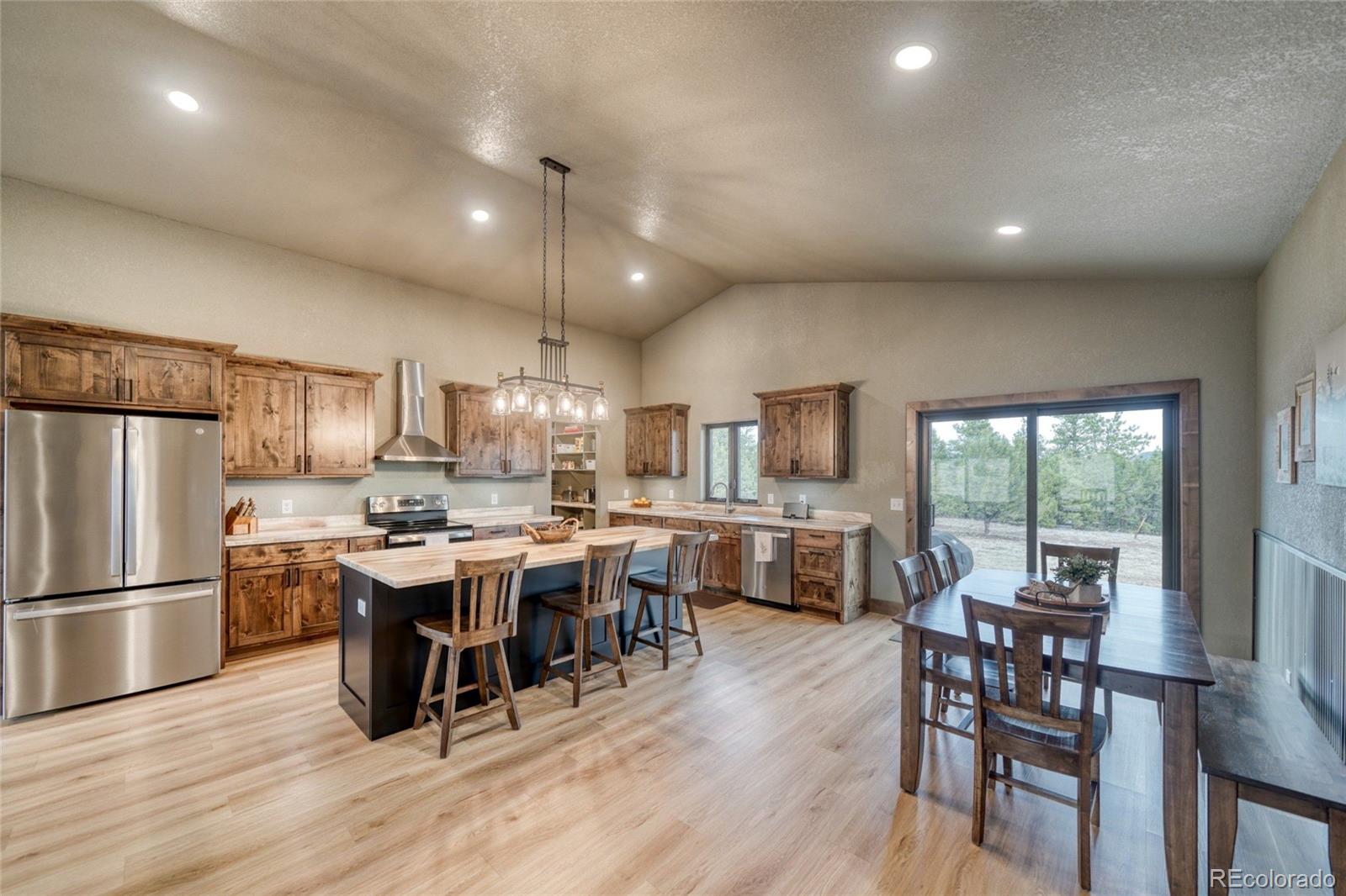 946 Hitching Post Road Cotopaxi, CO 81223 - Photo 14 of 50 a view of a dining room with furniture window and wooden floor