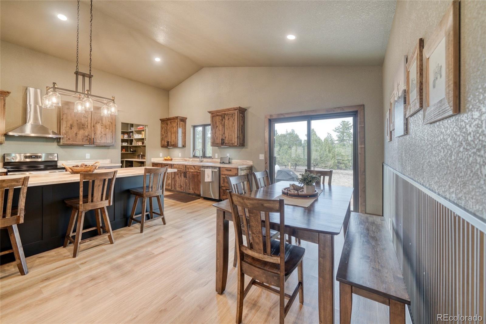 946 Hitching Post Road Cotopaxi, CO 81223 - Photo 23 of 50 a view of a dining room with furniture window and wooden floor