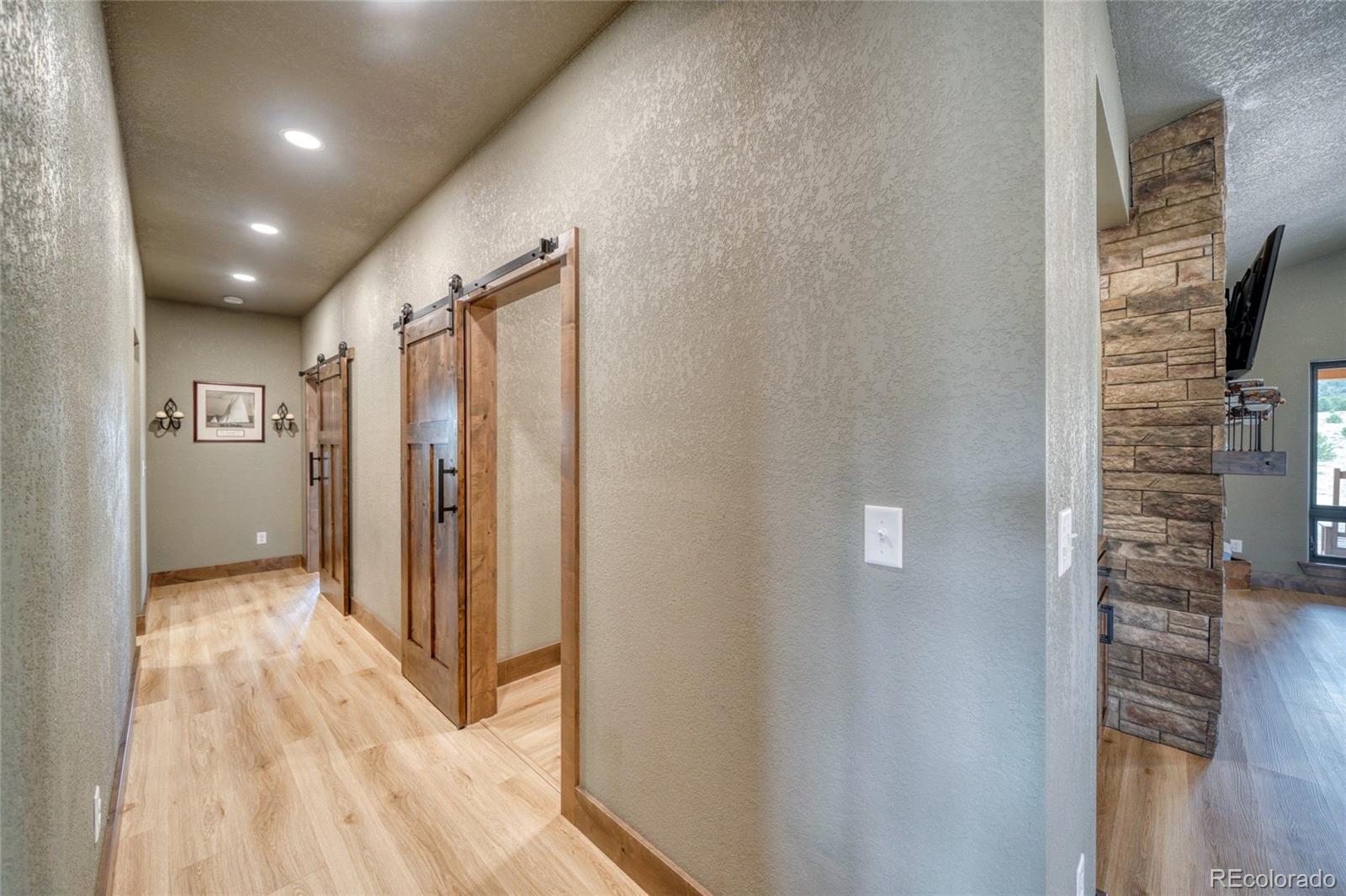 946 Hitching Post Road Cotopaxi, CO 81223 - Photo 24 of 50 a view of hallway with wooden floor