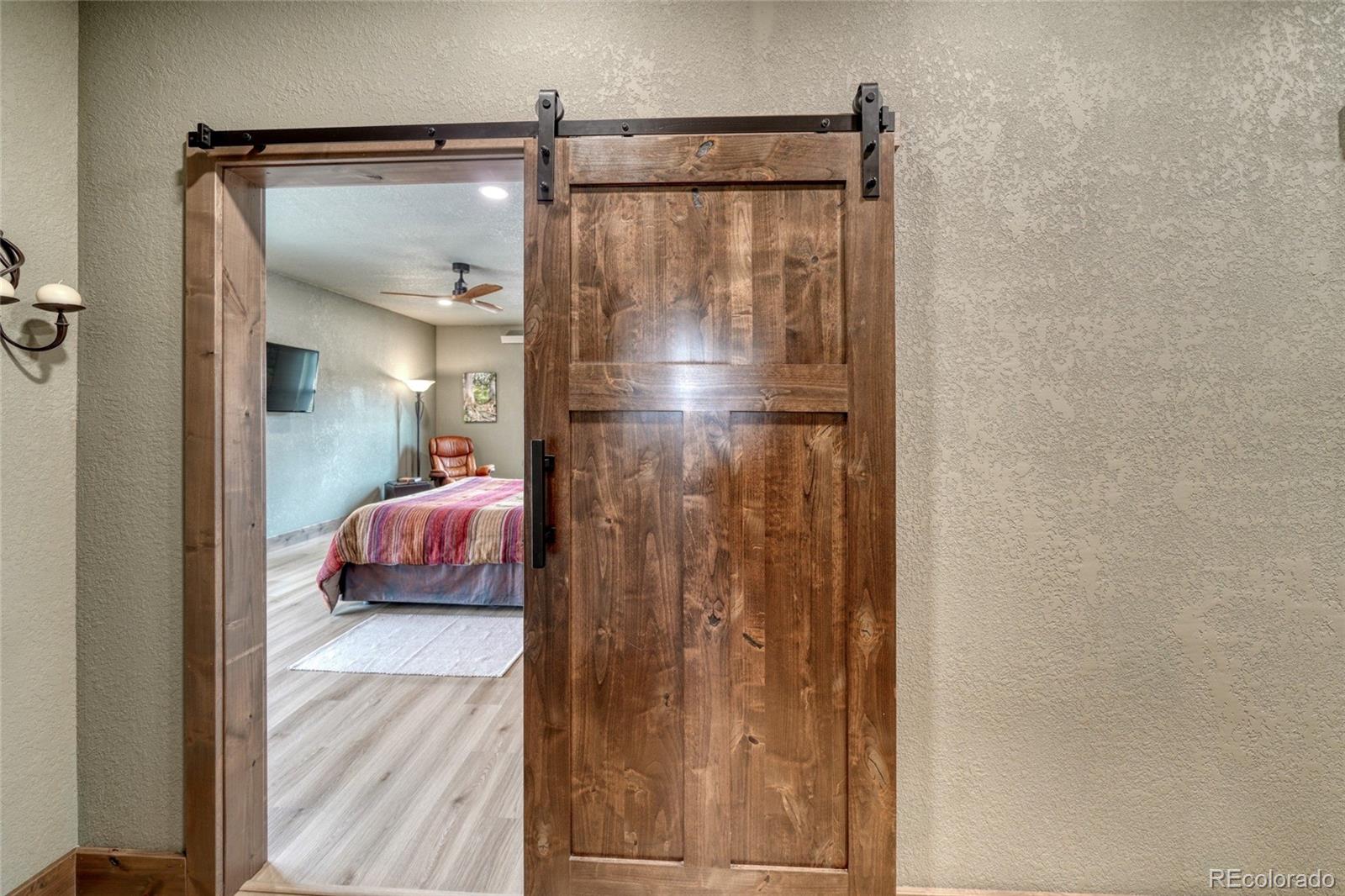 946 Hitching Post Road Cotopaxi, CO 81223 - Photo 25 of 50 a bathroom with a glass shower door