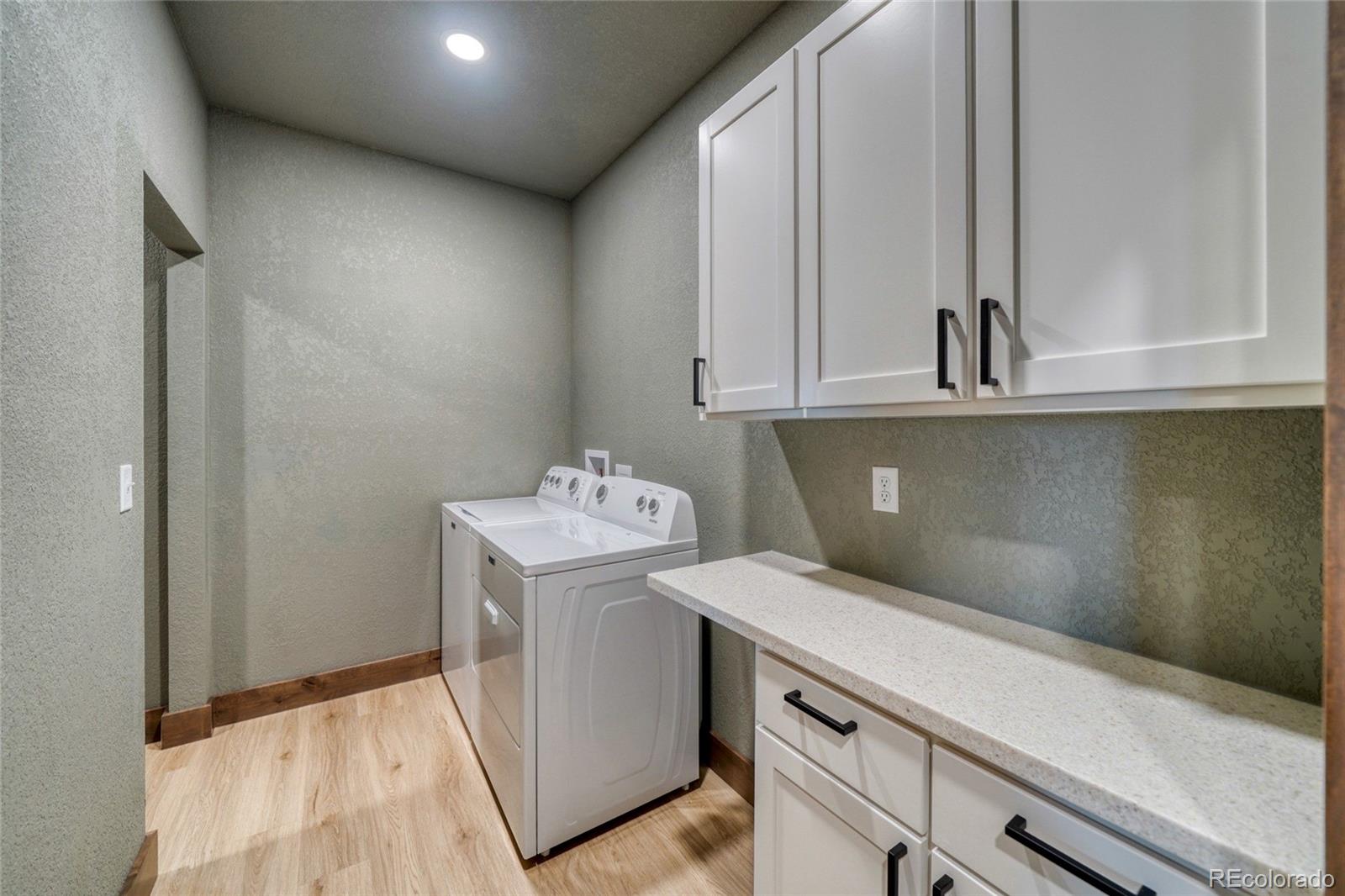 946 Hitching Post Road Cotopaxi, CO 81223 - Photo 33 of 50 a utility room with dryer and washer