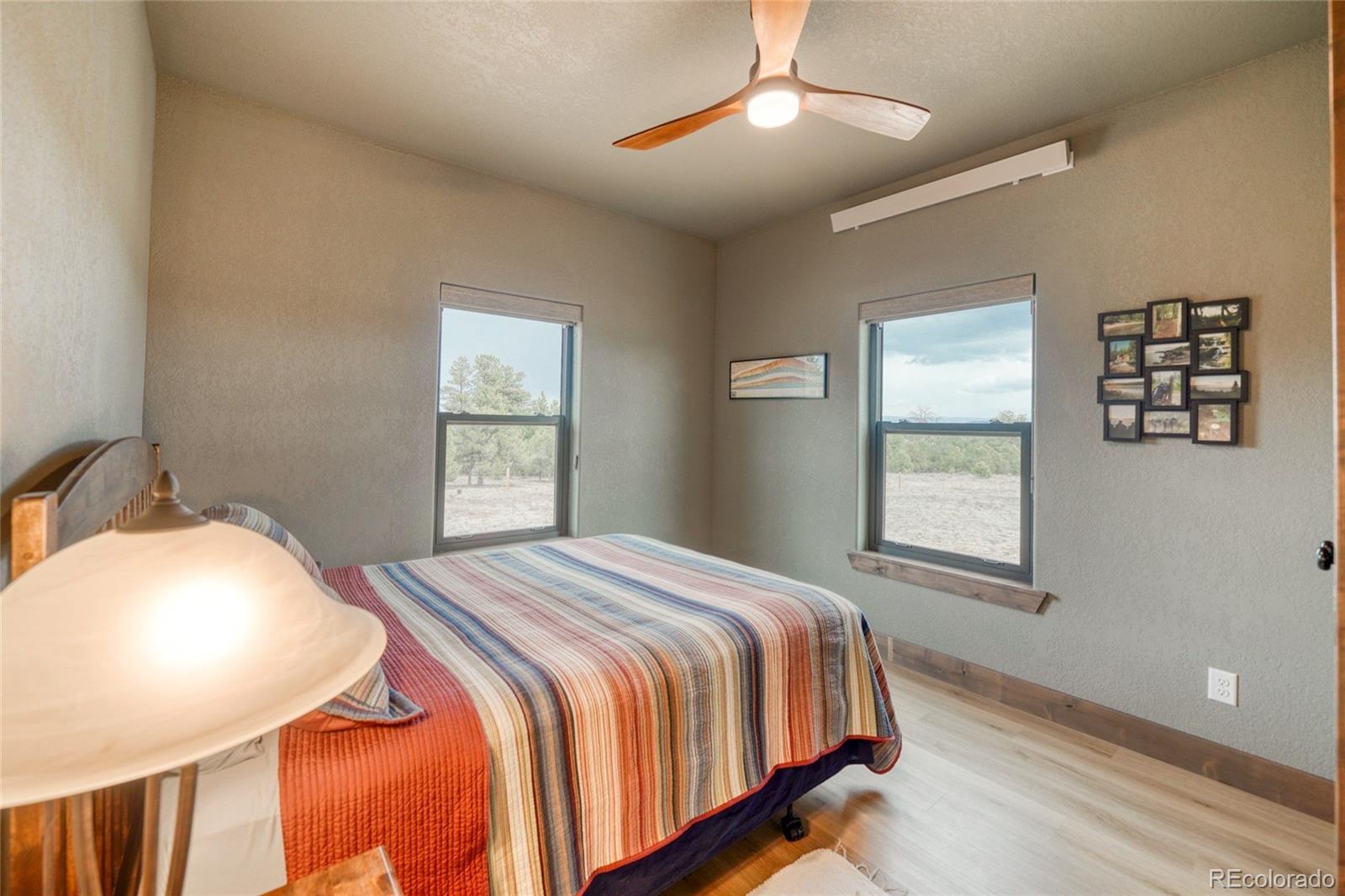 946 Hitching Post Road Cotopaxi, CO 81223 - Photo 34 of 50 a bedroom with a bed and a window