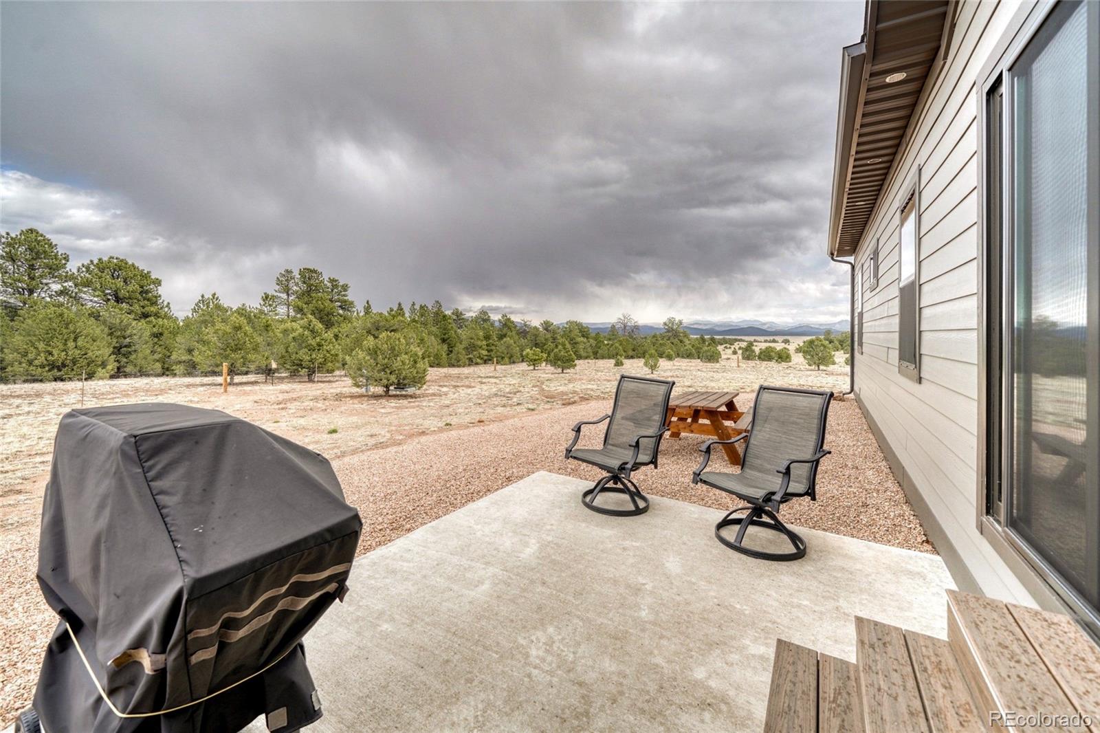 946 Hitching Post Road Cotopaxi, CO 81223 - Photo 39 of 50 a view of a swimming pool with chair and wooden floor