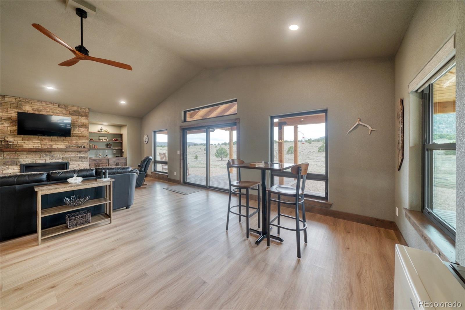 946 Hitching Post Road Cotopaxi, CO 81223 - Photo 8 of 50 a view of a kitchen with furniture and a wooden floor