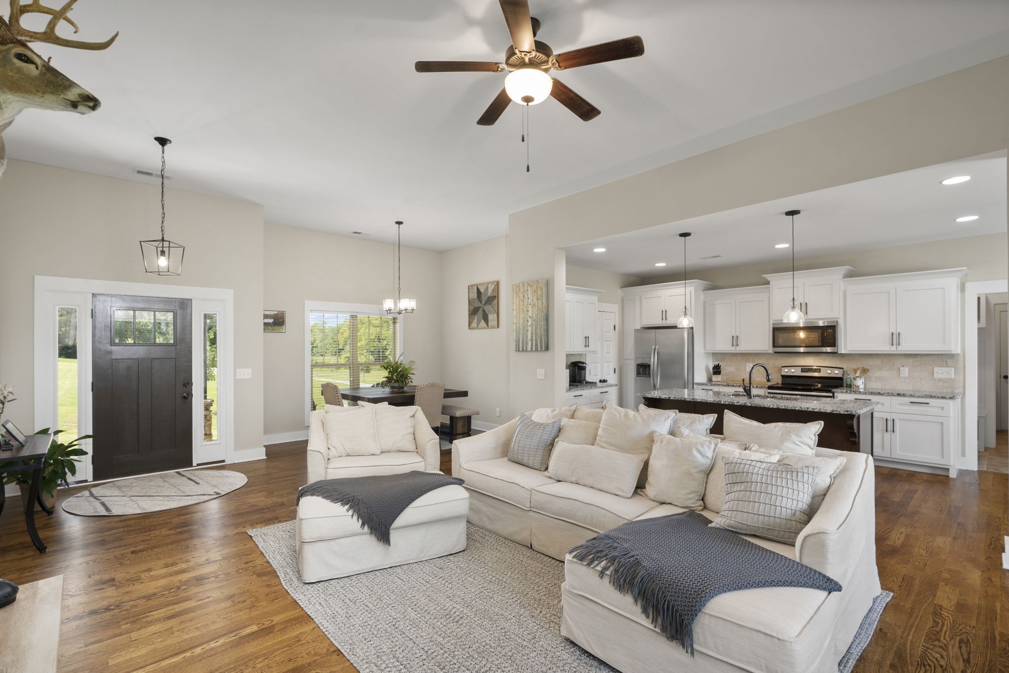 4480 Benson Road Springfield, TN 37172 - Photo 23 of 61 a living room with furniture kitchen view and a wooden floor
