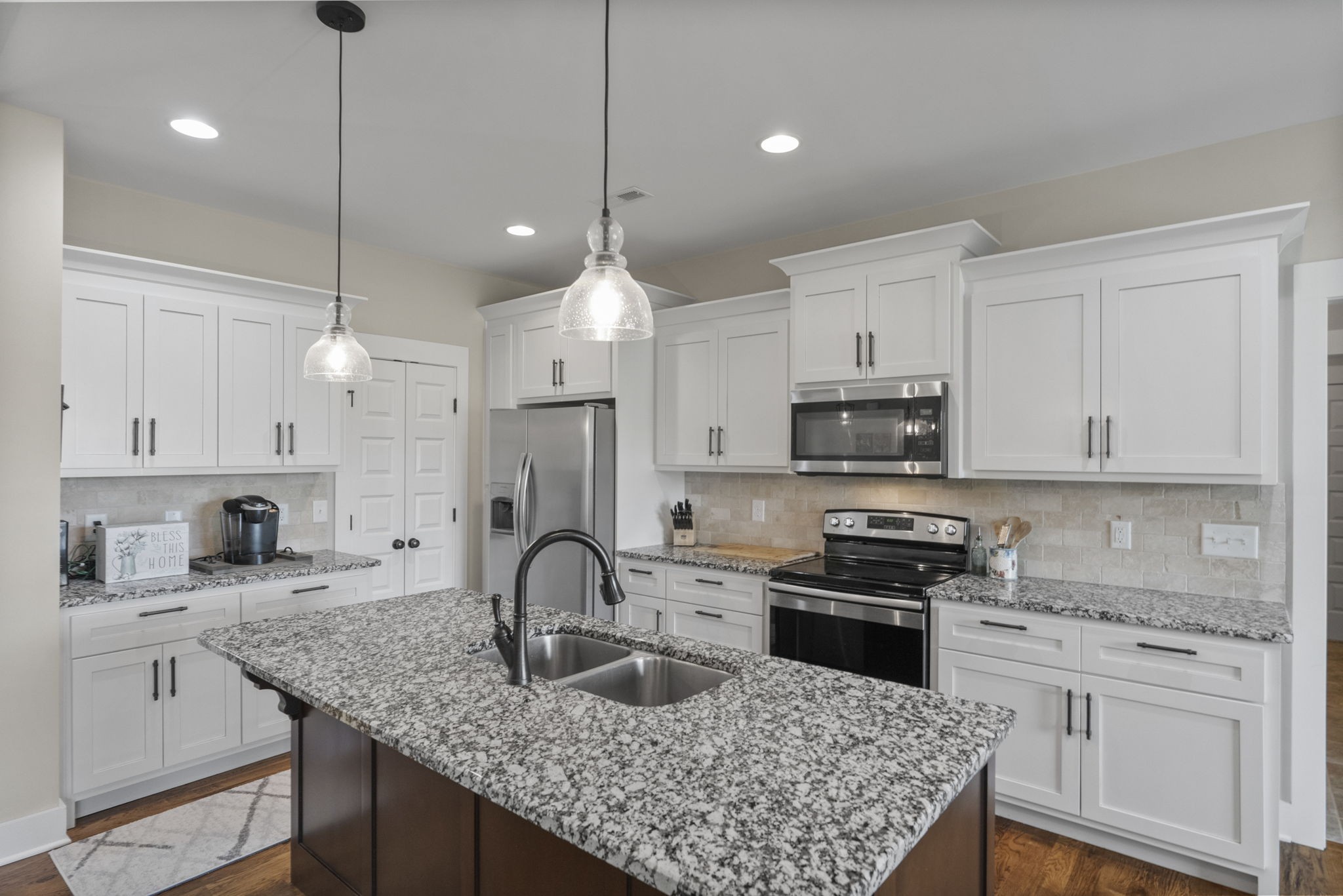 4480 Benson Road Springfield, TN 37172 - Photo 32 of 61 a kitchen with kitchen island granite countertop a sink a counter space appliances and cabinets
