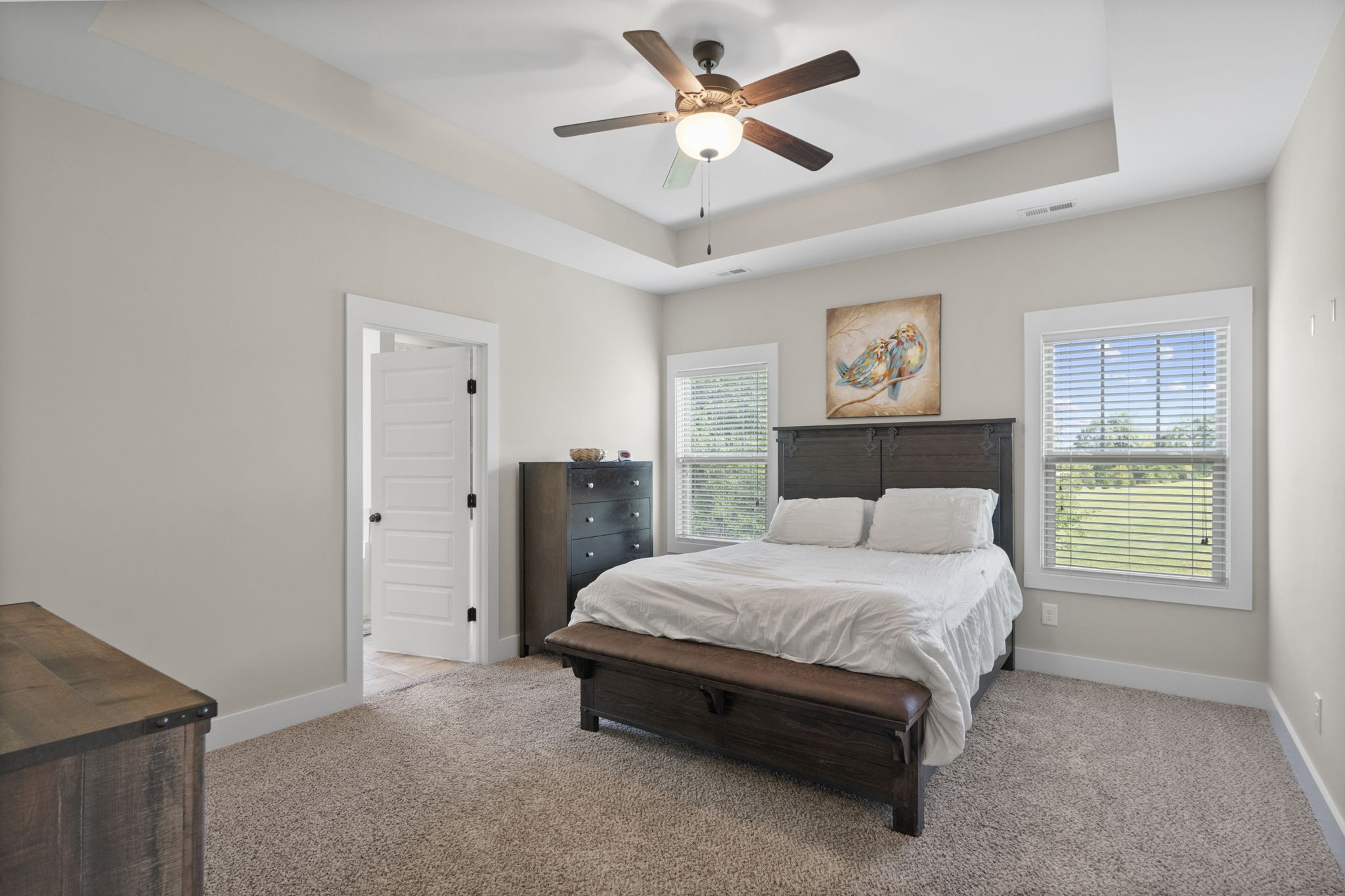 4480 Benson Road Springfield, TN 37172 - Photo 40 of 61 a spacious bedroom with a bed and a chandelier