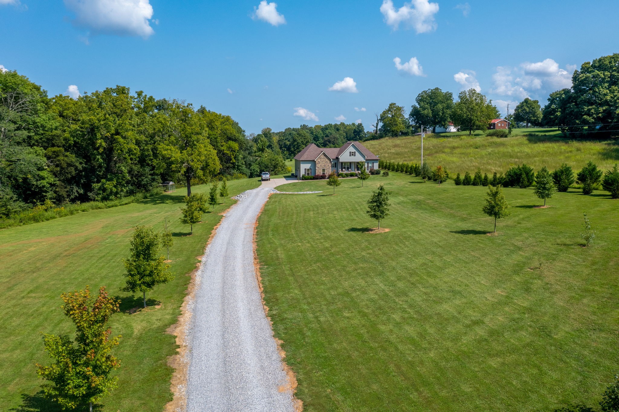 4480 Benson Road Springfield, TN 37172 - Photo 7 of 61 a view of a golf course with a lake