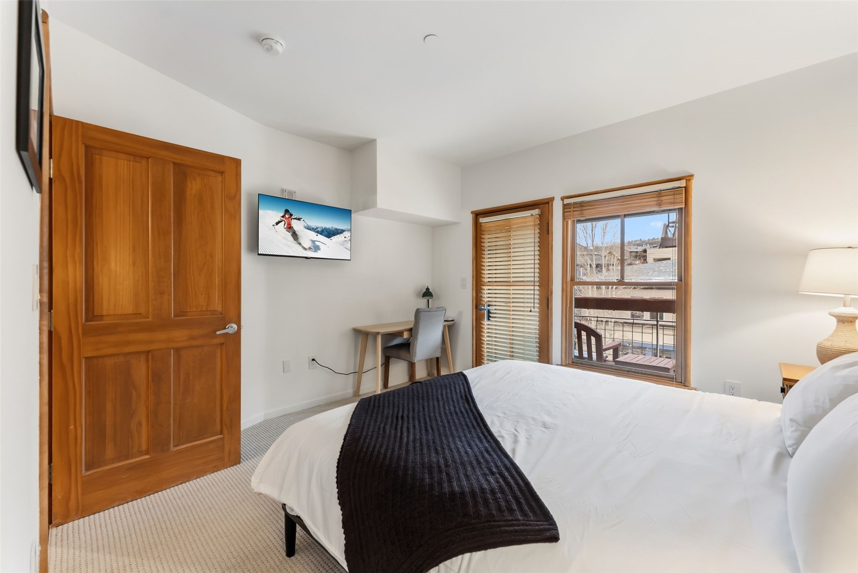 195 River Run Road, Unit 8015 Keystone, CO 80435 - Photo 18 of 35 a bedroom with a bed a table and a window