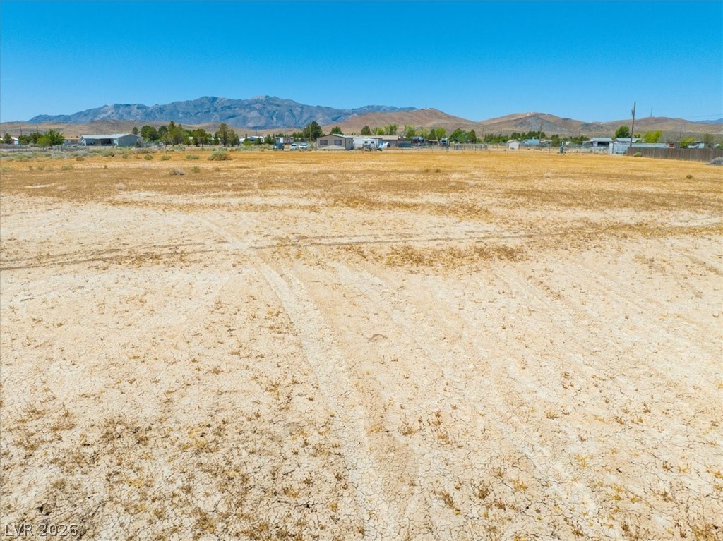 4610 Lawrence Road Pahrump, NV 89048 - Photo 15 of 42 A vast, undeveloped lot with distant mountain views awaits your vision.