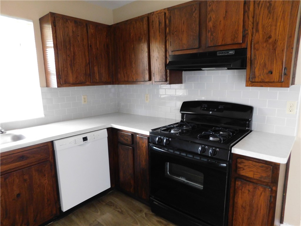 1900 Prairie Knoll Court, Unit A Austin, TX 78758 - Photo 6 of 18 a kitchen with sink and cabinets