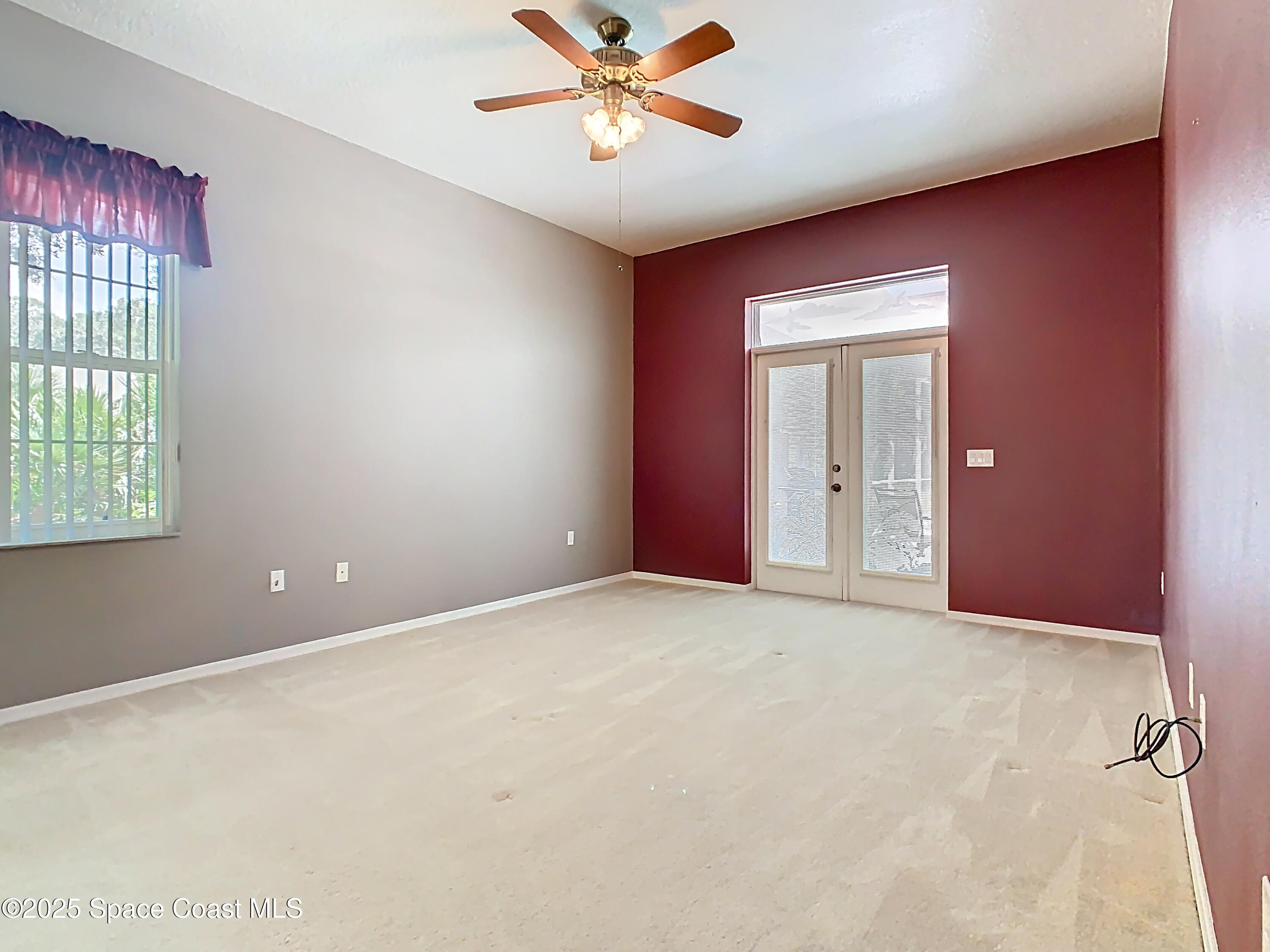 2559 Hooper Road Cocoa, FL 32926 - Photo 20 of 46 Primary suite with french doors to pool
