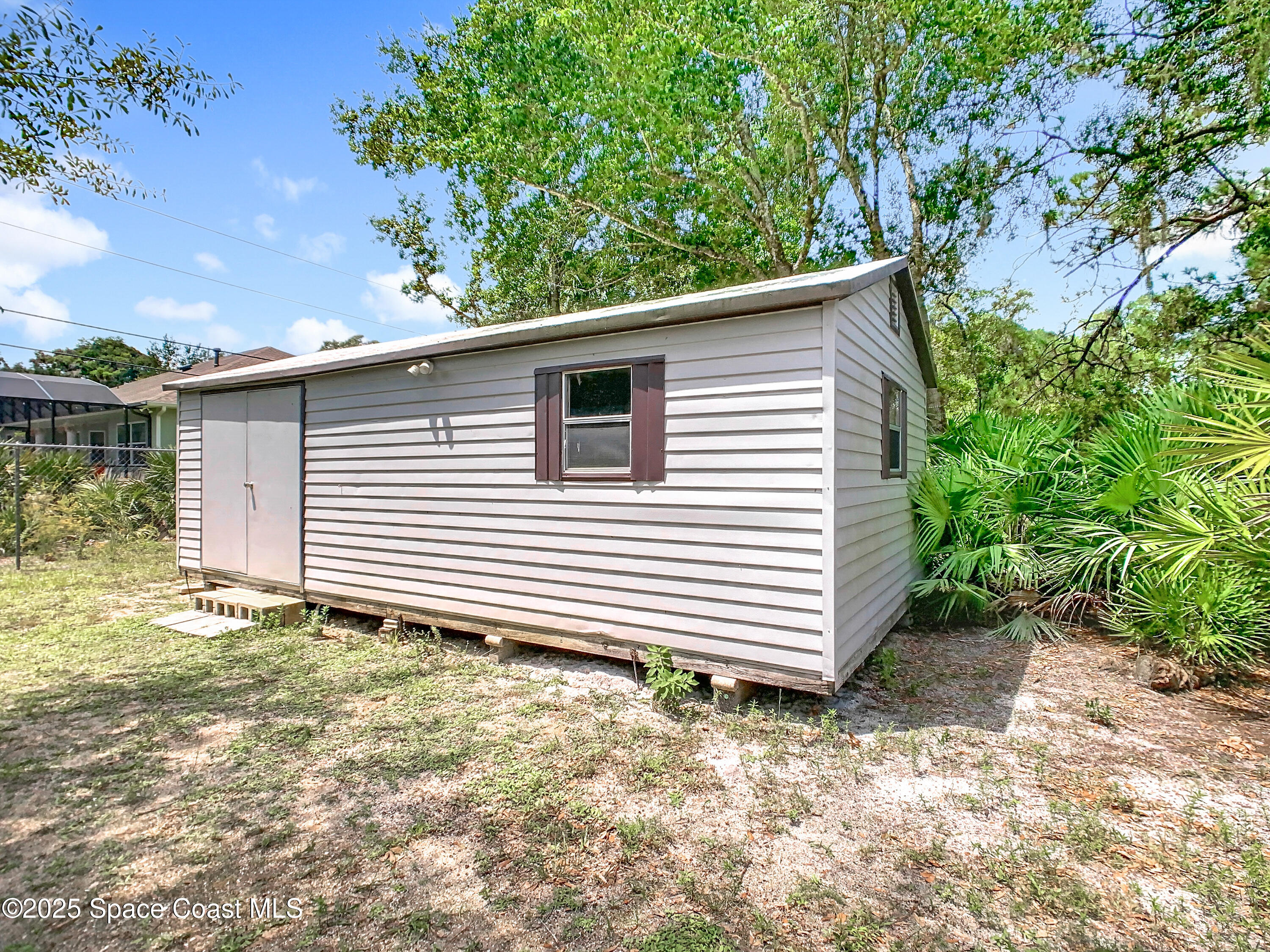 2559 Hooper Road Cocoa, FL 32926 - Photo 34 of 46 Storage shed