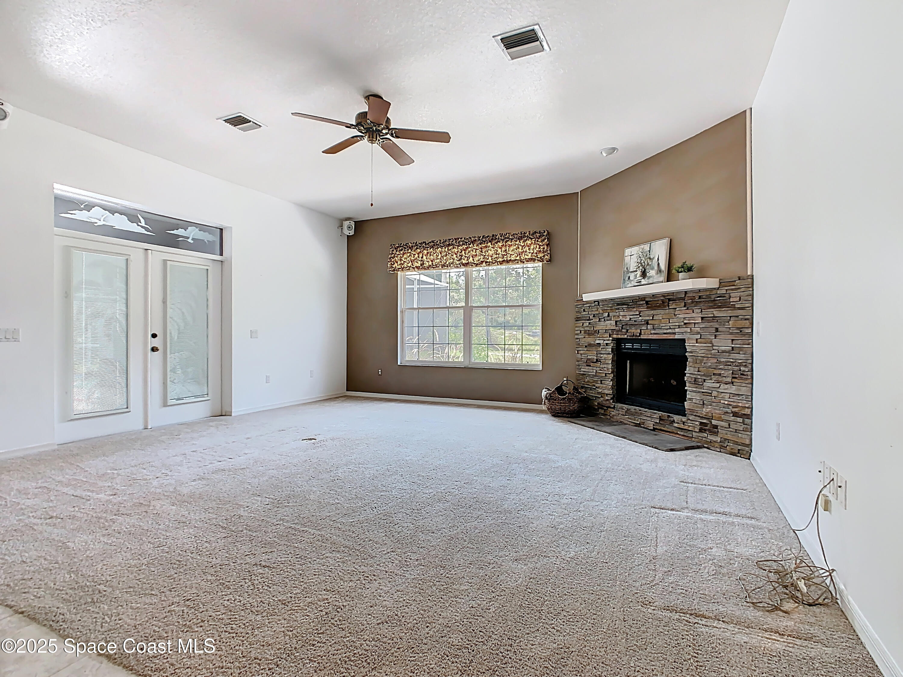 2559 Hooper Road Cocoa, FL 32926 - Photo 10 of 46 Family room with fire place
