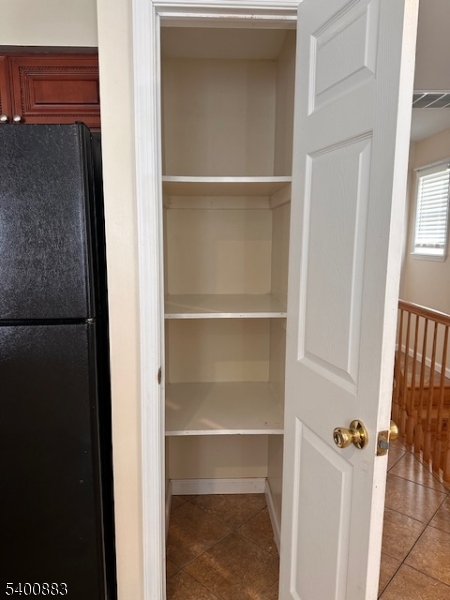31 Morrell Street, Unit 2B Elizabeth, NJ 07201 - Photo 11 of 23 a view of walk in closet with empty racks