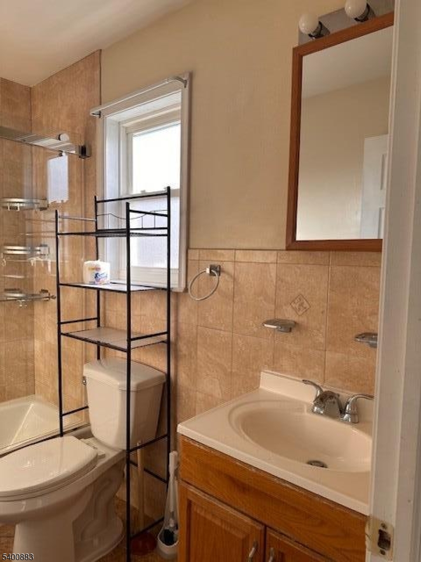 31 Morrell Street, Unit 2B Elizabeth, NJ 07201 - Photo 17 of 23 a bathroom with a sink and a mirror