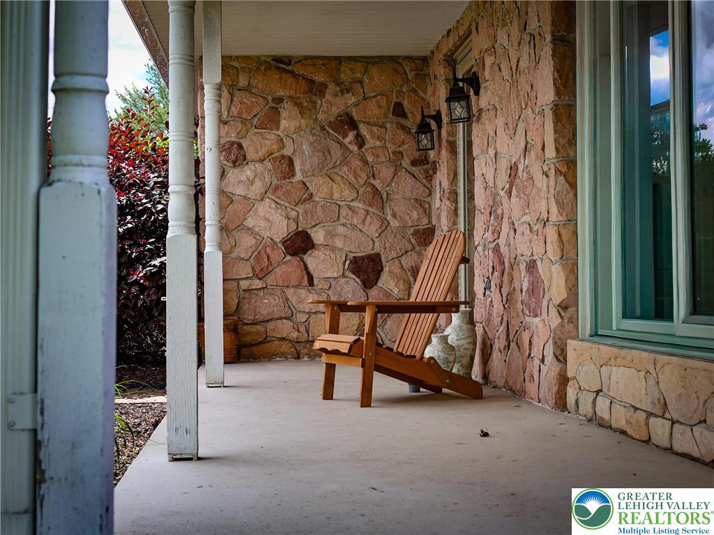 10 Dusty Road Easton, PA 18045 - Photo 13 of 35 A welcoming front porch features rugged stone construction and classic columns.