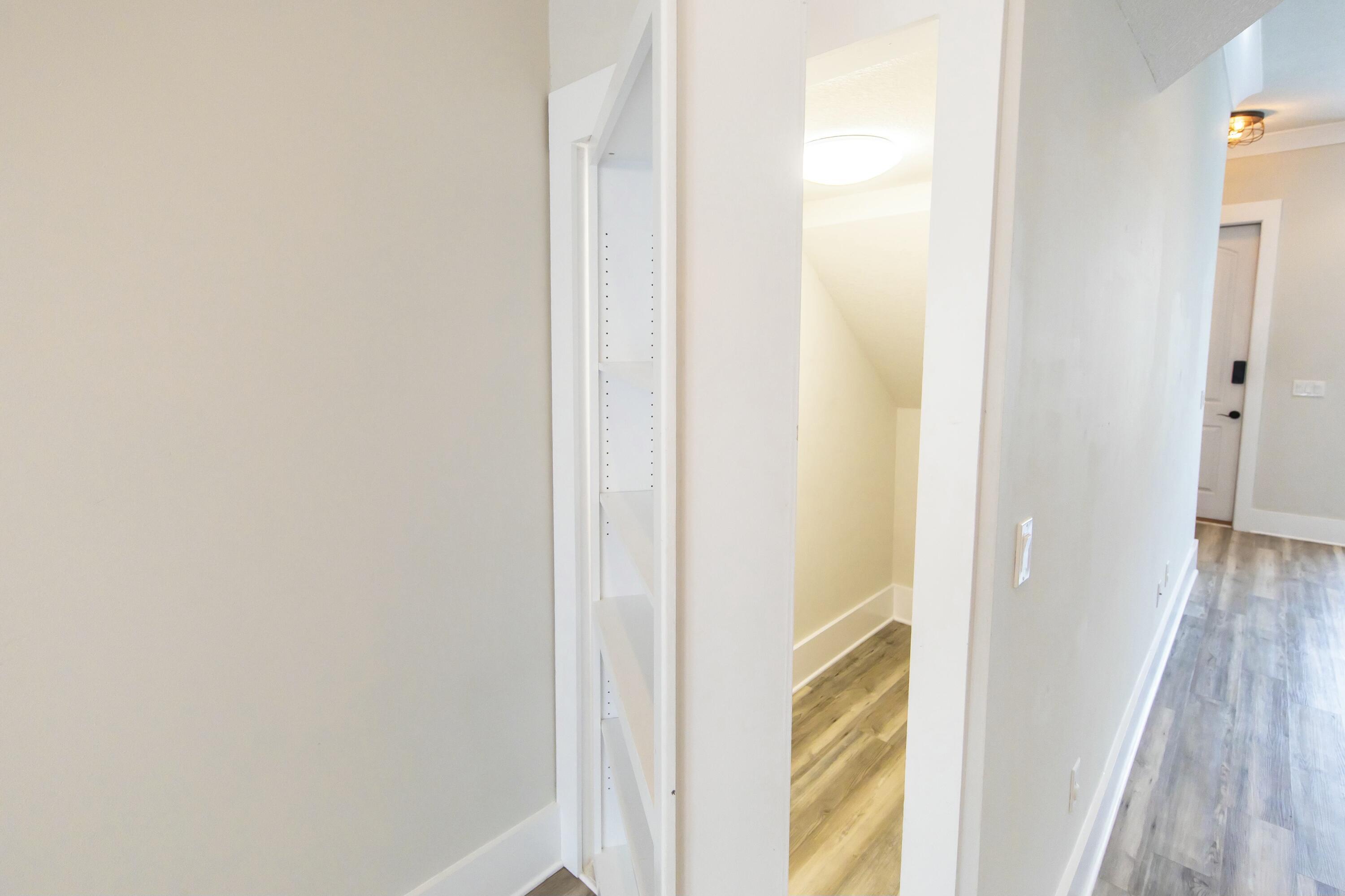 995 Airport Road, Unit 37 Destin, FL 32541 - Photo 11 of 46 a view of a bathroom from a hallway