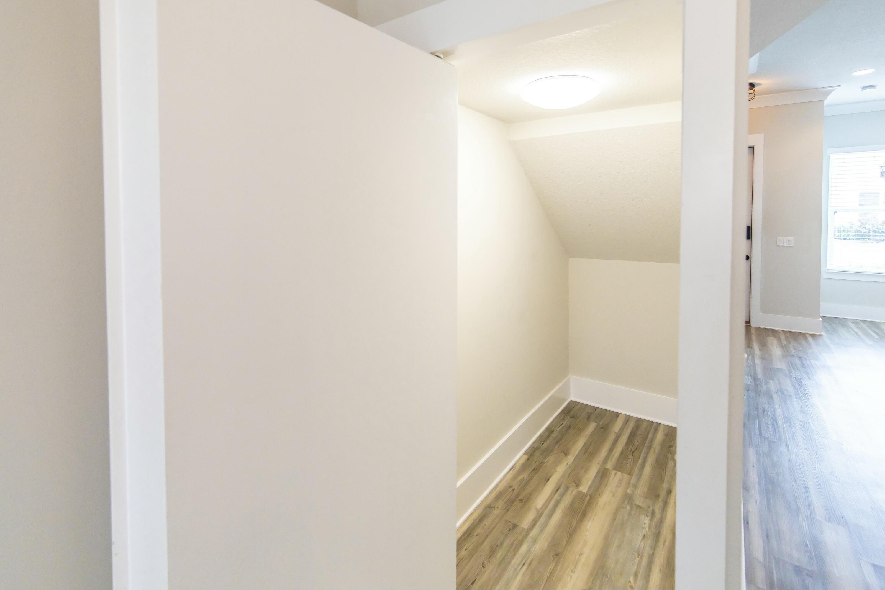 995 Airport Road, Unit 37 Destin, FL 32541 - Photo 12 of 46 a view of a bathroom with wooden floor