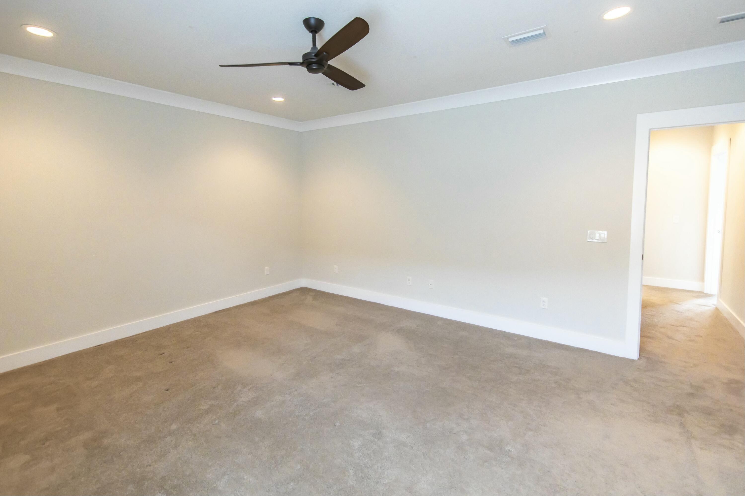 995 Airport Road, Unit 37 Destin, FL 32541 - Photo 22 of 46 an empty room with a empty space and windows