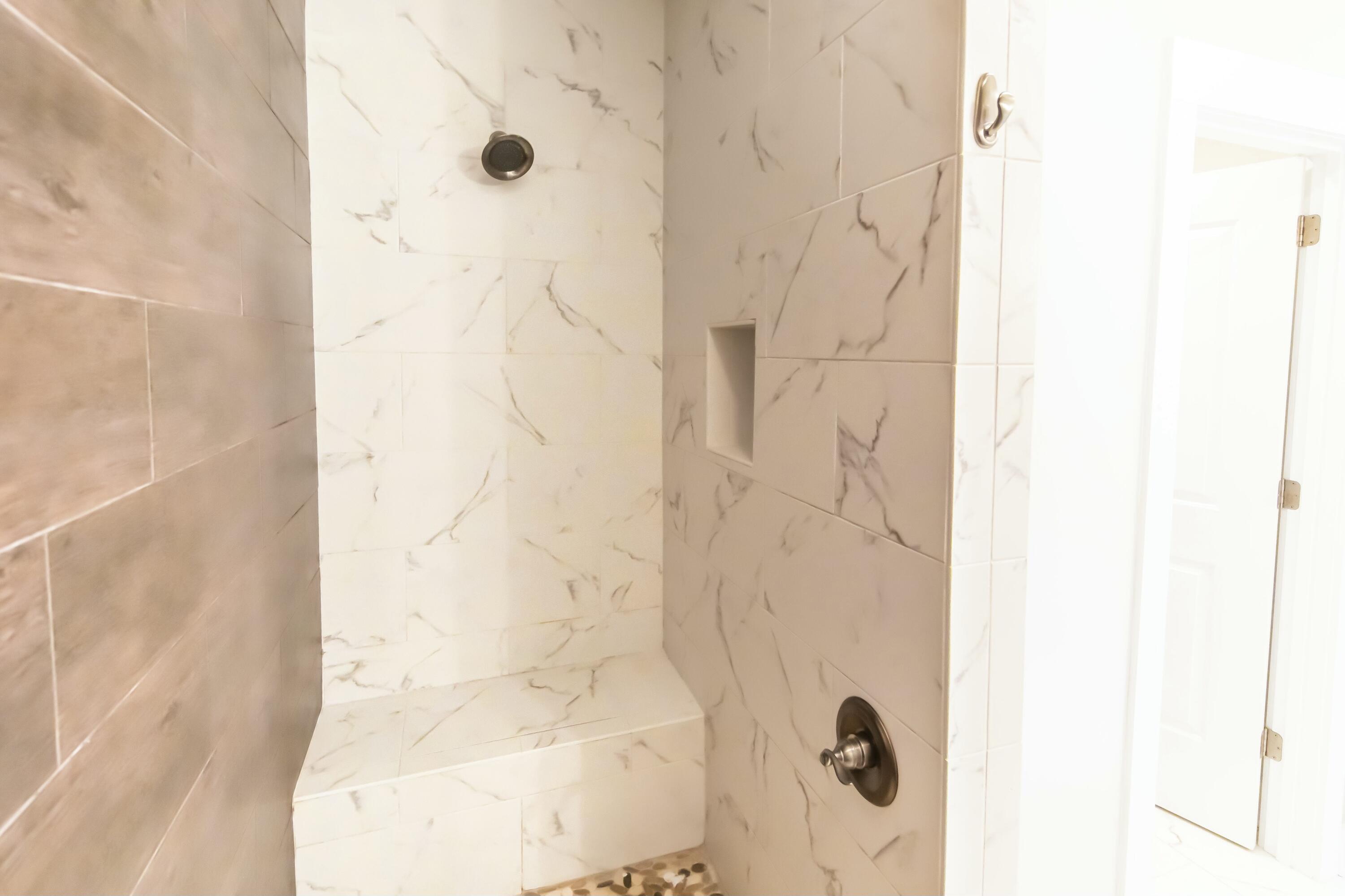 995 Airport Road, Unit 37 Destin, FL 32541 - Photo 26 of 46 a bathroom with a shower